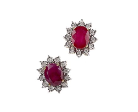 PAIR OF RUBY AND DIAMOND EARRINGS, the oval rubies totalling approximately 3.85 carats, within a halo of illusions set diamon