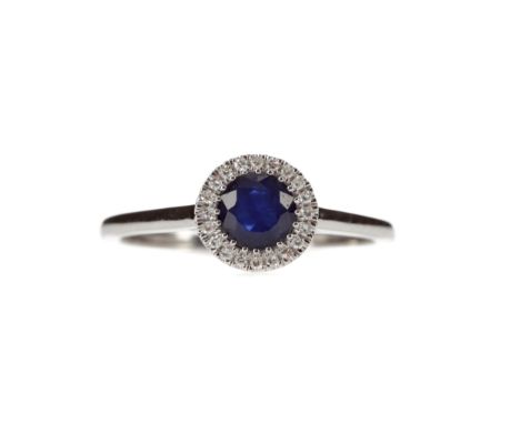 SAPPHIRE AND DIAMOND RING, set with a round sapphire within a halo of round brilliant cut diamonds totalling approximately 0.