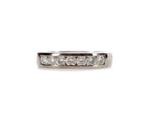 DIAMOND SEVEN STONE RING, the channel set round brilliant cut diamonds totalling approximately 0.35 carats, marked 500 for pa