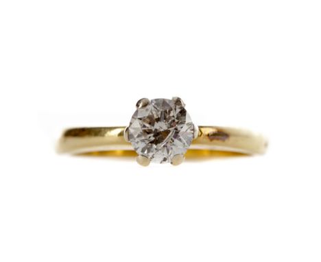 DIAMOND SOLITAIRE RING, set with a round brilliant cut diamond of approximately 0.67 carats, marked 750, size K 1/2, 4.1g