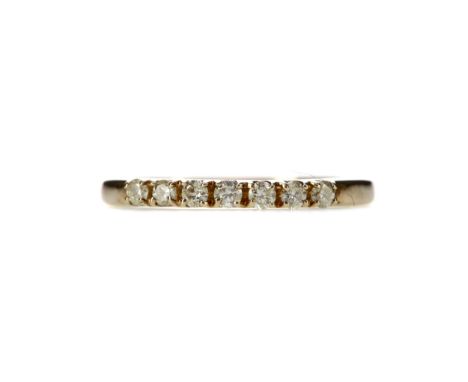 DIAMOND SEVEN STONE RING, set with round brilliant cut diamonds totalling approximately 0.35 carats, in nine carat gold, size