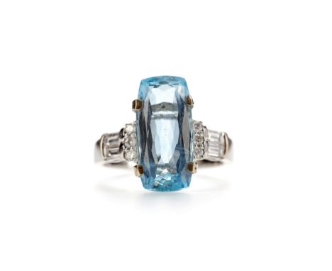 AQUAMARINE AND DIAMOND RING, set with an elongated aquamarine of approximately 4.95 carats flanked by round brilliant and bag