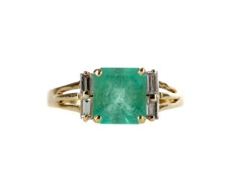EMERALD AND DIAMOND RING, set with an emerald cut emerald of approximately 1.73 carats flanked by two baguette cut diamonds o