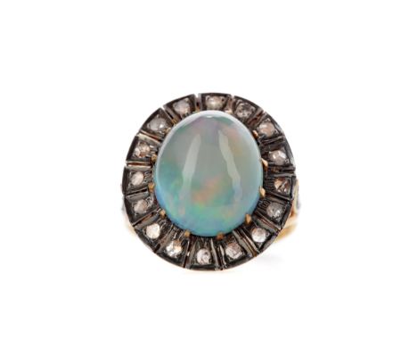 ETHIOPIAN OPAL AND DIAMOND RING, set with an oval cabochon Ethiopian opal surrounded by rose cut diamonds, with diamonds to e