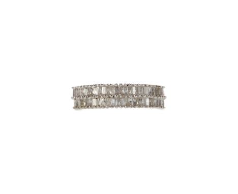 DIAMOND RING, set with two rows of baguette cut diamonds totalling approximately 0.50 carats, in silver, size O, 3.2g