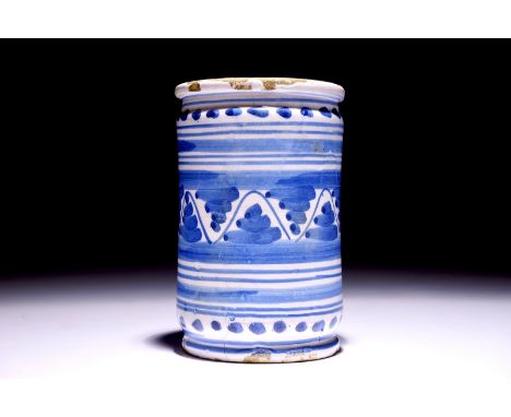 A Dutch Delft blue and white albarello with ornamental design, 17th C. H.: 16 cm - Dia.: 10 cm  Condition reports and high re