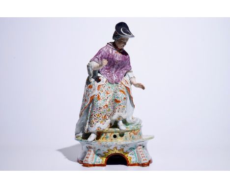 A massive Dutch Delft polychrome petit feu fountain in the shape of a lady, 18th C. Dim.: H.: 60 cm - L.: 35 cm - W.: 22 cm  