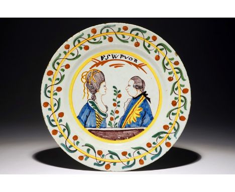 A Dutch Delft polychrome orangist portrait charger, 18th C. Dia.: 34,5 cm  Condition reports and high resolution pictures are