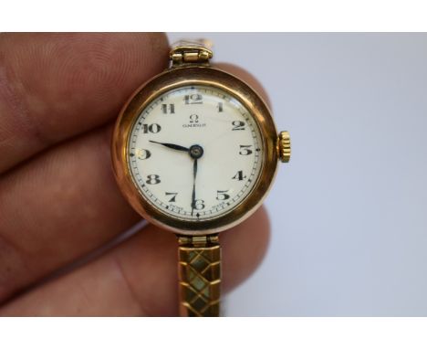 A vintage Omega 9ct gold ladies mechanical wristwatch, on replacement expanding bracelet.