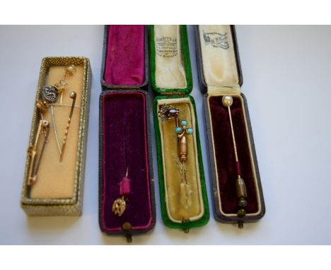 Nine various stick and tie pins, some gold and a gold bar brooch with steel pin.