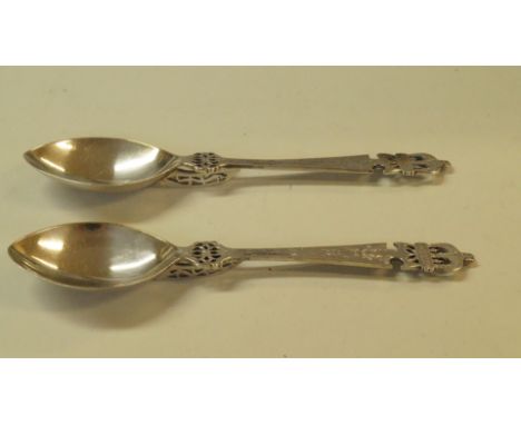 A pair of Victorian ornate silver spoons, by Henry Wilkinson & Co, Sheffield 1869, having crown terminals, 106g.