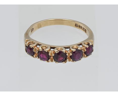 A 9 carat five stone ruby set ring approx. 2.8 grams