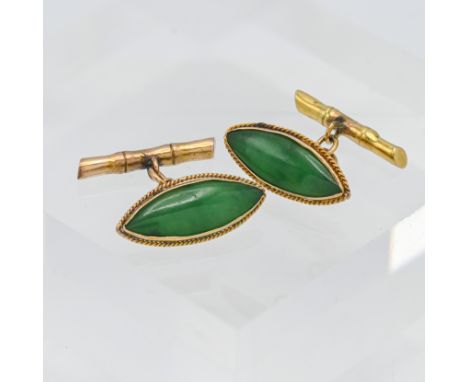 A pair of green jade? Yellow metal cufflinks. Indistinct marks with faux bamboo fittings