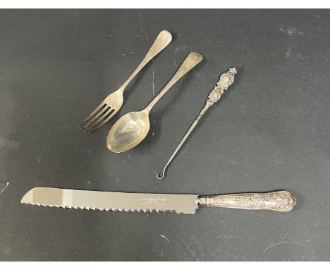 A silver spoon, Sheffield, circa 1912-13 together with a silver fork, silver handle hook and silver handle knife, total weigh