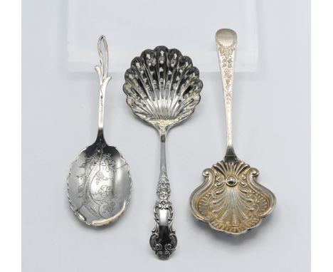 Two silver caddy spoons and a silver castor spoon. Comprising the castor spoon 'Sheffield 1934 TC &amp;IWC' (3), Gross weight