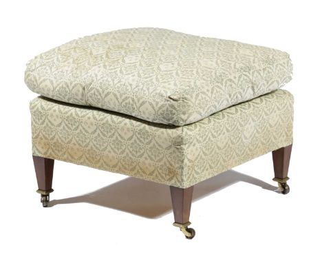 A WALNUT STOOL BY HOWARD & SONS, FIRST HALF 20TH CENTURYcovered with 'H&S' ticking, on square tapering legs and brass castors