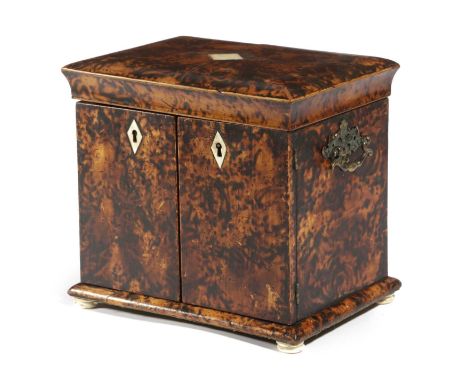 λA GEORGE III FAUX TORTOISESHELL TABLE CABINETLATE 18TH CENTURYwith a hinged cover above a pair of doors enclosing three draw