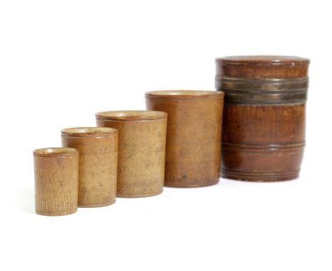 A TREEN BARREL NEST OF CUPS POSSIBLY SCANDINAVIAN, FIRST HALF 19TH CENTURYthe barrel with brass bands and reeded decoration, 