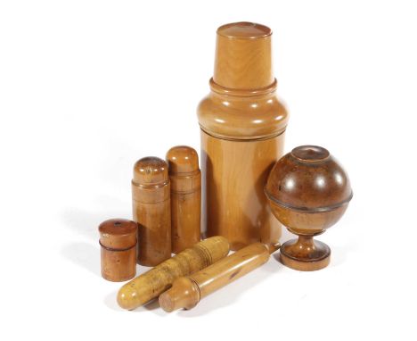 A BOXWOOD MEDICINE BOTTLE CASE AND COVEREARLY 20TH CENTURYcontaining a glass bottle, stopper and beaker, two cylindrical powd