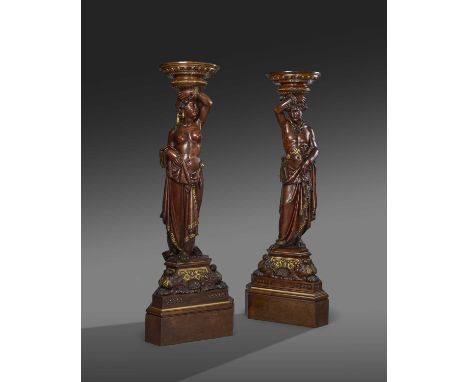 λ A FINE PAIR OF ITALIAN WALNUT FIGURAL TORCHÈRESBY ANGIOLIO BARBETTI (1805-1873), FLORENCE, DATED '1866'in the form of a sca