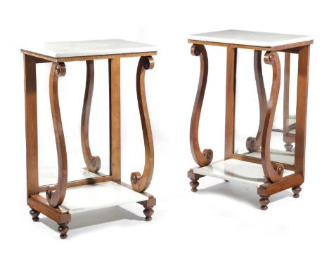 A PAIR OF NORTH EUROPEAN SATINWOOD CONSOLE TABLES19TH CENTURYeach with a white marble top and base, with scroll front support