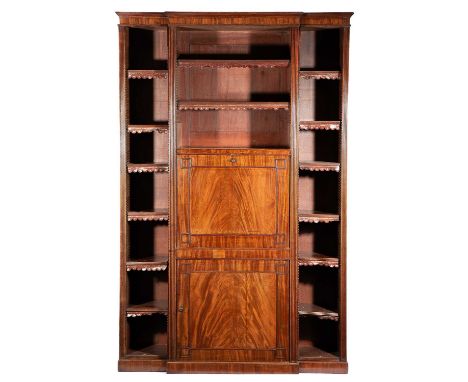λA MAHOGANY BREAKFRONT SECRÈTAIRE BOOKCASEEARLY 19TH CENTURY BUT LATER ADAPTEDwith open adjustable shelves, the central secti