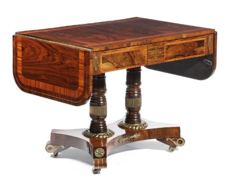 λ A REGENCY ROSEWOOD AND BRASS MOUNTED SOFA TABLEEARLY 19TH CENTURYthe drop-leaf top with satinwood banding above a pair of f