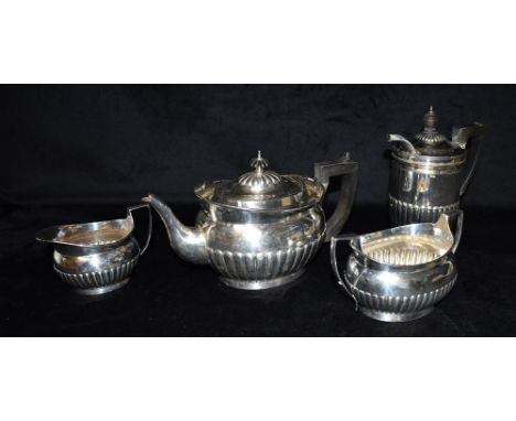 A SILVER FOUR PIECE TEA SET  the set comprising of a teapot, hot water jug, twin handled sugar bowl and a creamery, the set w