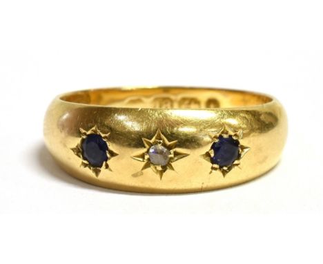 A LATE VICTORIAN 18CT GOLD DIAMOND AND SAPPHIRE GYPSY SET RING The yellow gold ring hallmarked for Birmingham 1885, ring sixe