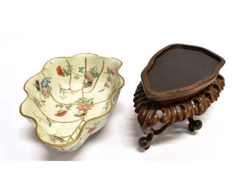 A CHINESE PORCELAIN LEAF SHAPED BOWL with raised and lobed sides, polychrome painted with insects and flowers, the base with 