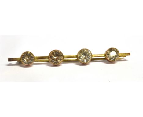 A ZIRCON FOUR STONE 9CT GOLD BAR BROOCH white and light brown round mixed cut zircon approx. 7mm diameter average each, stamp