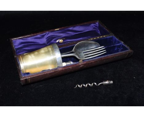 A CASED TRAVELLING CUTLERY SET  the set comprising of a silver rimmed beaker, silver fork and spoon, Sheffield steel knife an