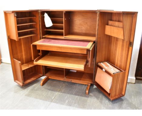 A NEWCRAFT 'HOME OFFICE' TEAK FOLDING COMPACTUM DESK  the front opening to an array of shelves, filing compartment, sliding g