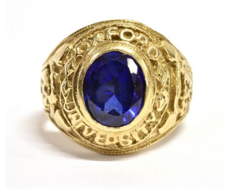A MARKED 375 SAPPHIRE BOMBE RING The oval sapphire measuring 0.9cm x 0.6cm in an ornate setting and shoulders, setting measur