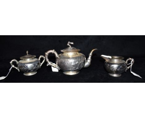 A CHINESE EXPORT THREE PIECE TEA SET comprising teapot, covered sugar bowl and milk jug, silver bamboo handle and spout Condi