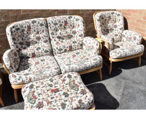 A LIGHT ERCOL BEECH FRAMED SOFA,  matching pair of chairs and stool Condition Report : very good condition - complete with br