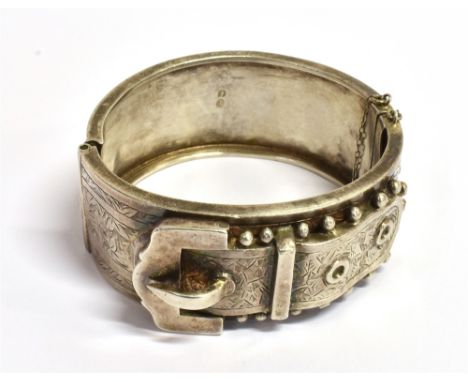 A VINTAGE SILVER BELT AND BUCKLE BANGLE  the bangle 2.6cm wide, diameter 5.3cm, faded Birmingham hallmark, maker HB, weight 4