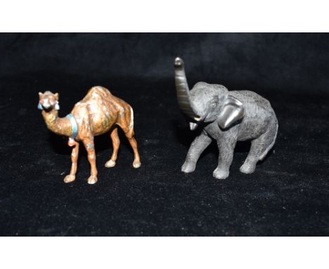 A BRONZE FIGURE OF AN ELEPHANT  standing with trunk raised, probably Japanese, 10cm high (lacking tusks); and a spelter figur