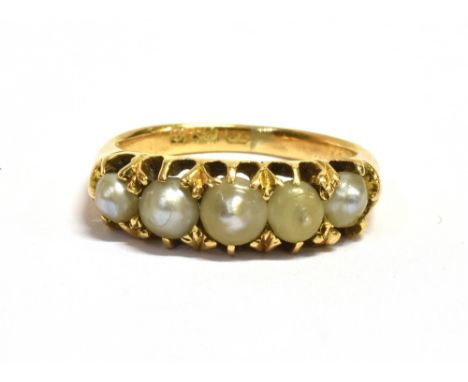 A LATE 19TH/EARLY 20TH CENTURY SEED PEARL DRESS RING  the ring set with five slightly graduated seed pearls, the central seed