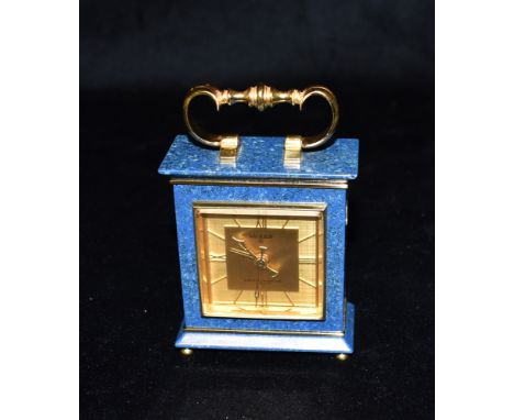 A SMALL MAPPIN &amp; WEBB 'LUXOR' 8-DAY ALARM CLOCK  in gilt brass and faux lapis lazuli case, 10.5cm high Condition Report :