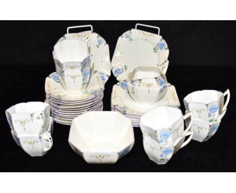 A COLLECTION OF SHELLEY 'QUEEN ANNE' SHAPE TEAWARES  decorated in the 11721 'Sweet Pea' pattern, Rd no 723404 to base, compri