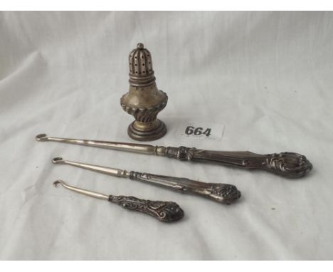 Three silver mounted button hooks and an 1899 pepper
