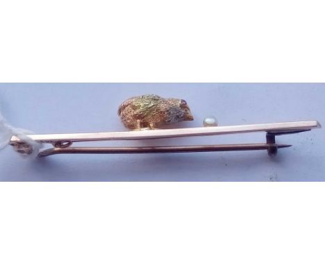 15ct marked bar brooch designed as a chicken pecking a pearl - three-colour gold