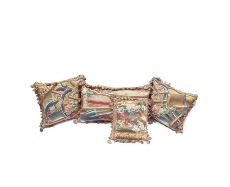 A collection of four cushions of tapestryEarly 18th century, adapted from the border of a Teniers tapestry probably woven in 