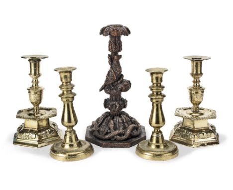 A Blackforest-style carved candlestick, mounted as a lamp19th centuryTogether with a pair of brass candlesticks, and a pair o