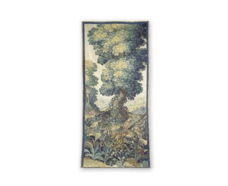 A fine verdure tapestry panelMid-17th century, FrenchDesigned with a central tree, a townscape to the middle distance and a p