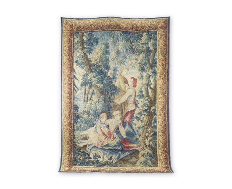 An Aubusson tapestryCirca 1750Designed with two courtly couples, set within a verdant landscape, the whole enclosed by elabor