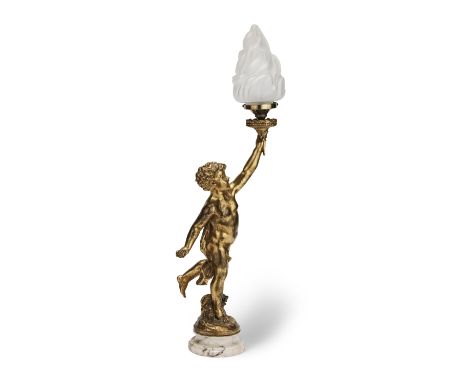 A gilt composition table lampFirst 20th centuryModelled as a putti with arm aloft holding flaming torch with a glass shade on