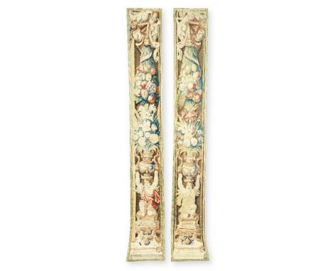 A pair of Flemish tapestry bordersCirca 1660-1670, Bruges or BrusselsDesigned with putti kneeling on plinths with ram mask he