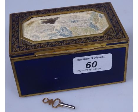 A brass and enamel-cased musical box, with inset needlework panel to the lid, width 4.5"